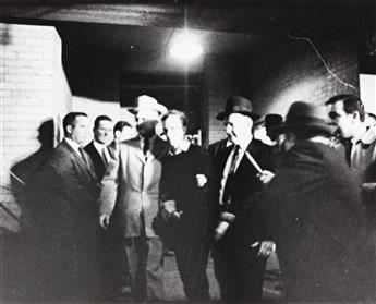 (THE ASSASSINATION OF JOHN F. KENNEDY) A pair of photographs documenting the slaying of Lee Harvey Oswald by Jack Ruby.